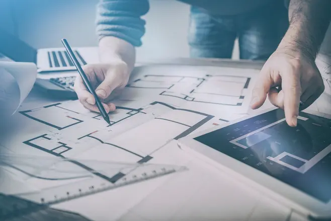An architect reviewing the plans